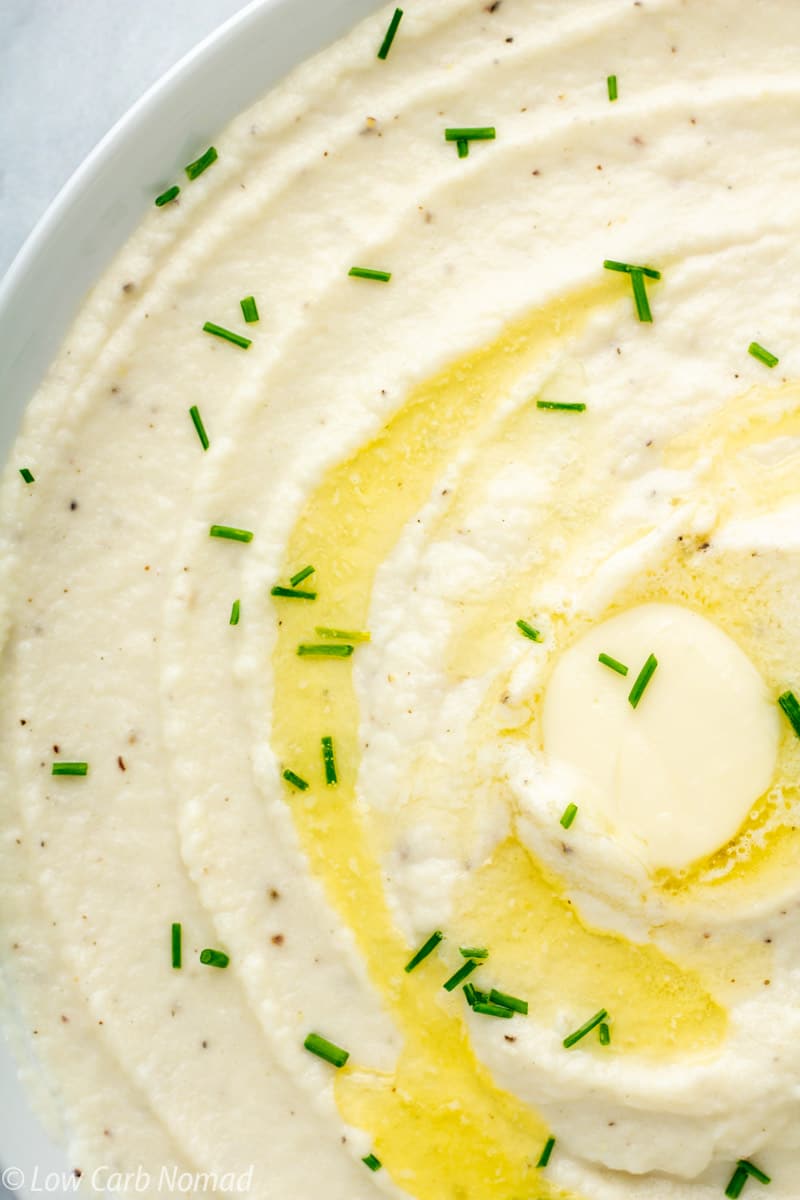 close up photo of mashed cauliflower in a bowl