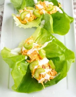 2 buffalo chicken lettuce wraps on a platter