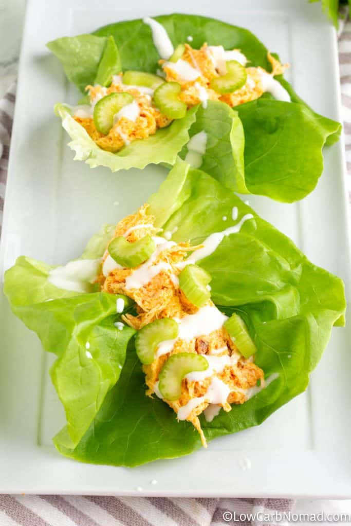 2 buffalo chicken lettuce wraps on a platter