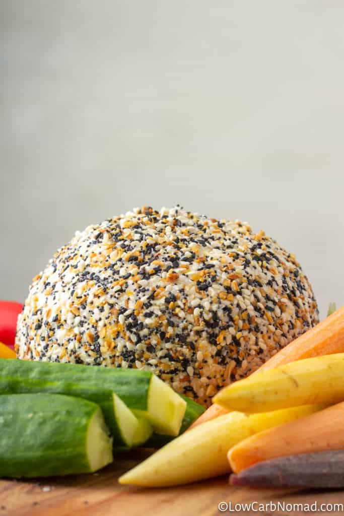 Everything bagel Cheeseball recipe on a platter with carrots, cucumbers, peppers and sugar snap peas