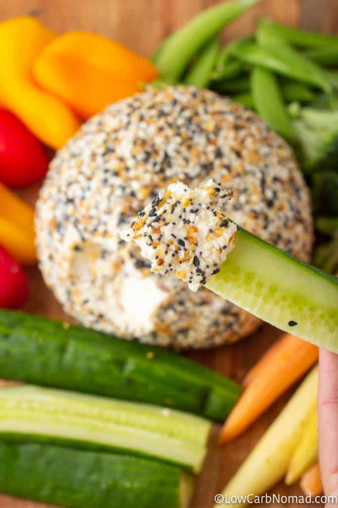 Everything Bagel Cheese Ball on a platter with fresh low carb veggies