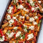 cooked keto fajita on a sheet pan with white queso