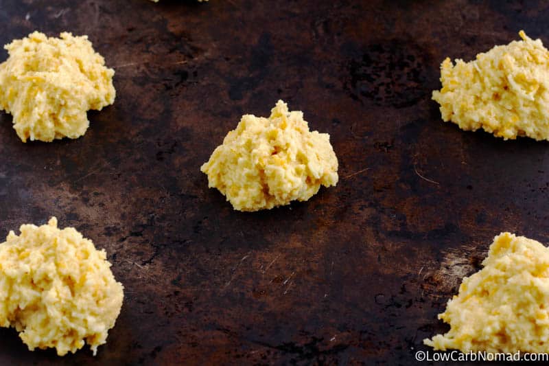 Keto Cheddar Biscuits unbaked on a tray to go in the oven