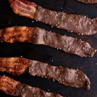 Low carb chocolate covered bacon on a tray
