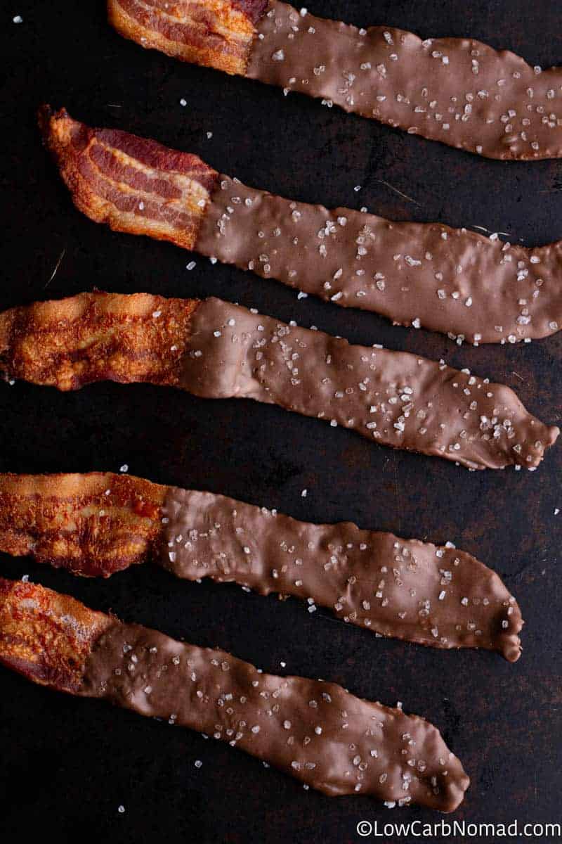 5 pieces of Sugar Free Chocolate Covered Bacon with Sea Salt on a plate