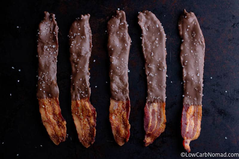 Keto Chocolate covered Bacon is a sweet and salty treat that while you might be hesitant to try is going to blow your taste buds away! With just two ingredients, sugar free chocolate and thick cut bacon you are going to have an amazing treat with this Chocolate Covered Bacon Recipe! 