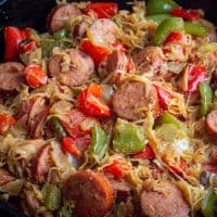 kielbasa and sauerkraut skillet recipe in a cast iron skillet