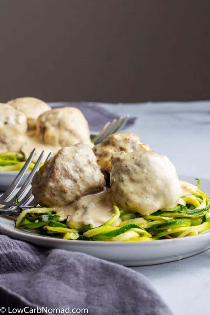 easy swedish meatballs over a zoodles on a plate