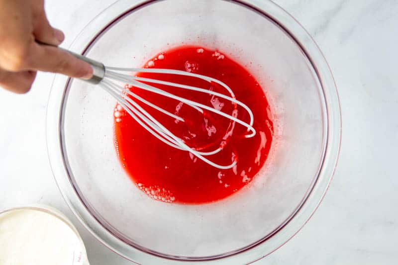 Boiling water being mixed into jello powder