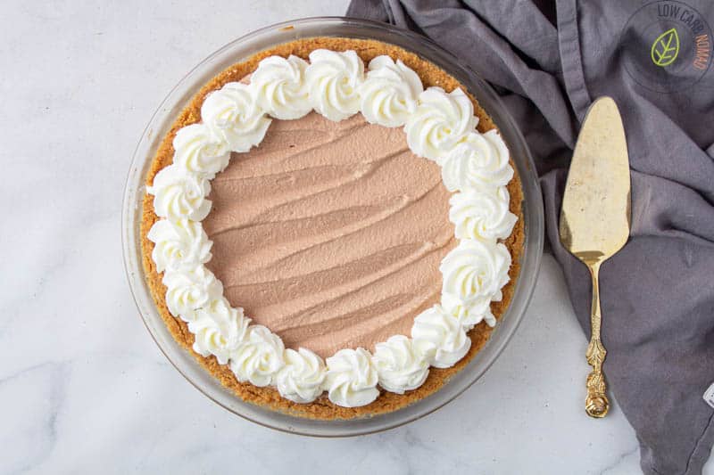 Chocolate Mousse pie finished - pie crust filled with chocolate mousse and topped with whipped cream.