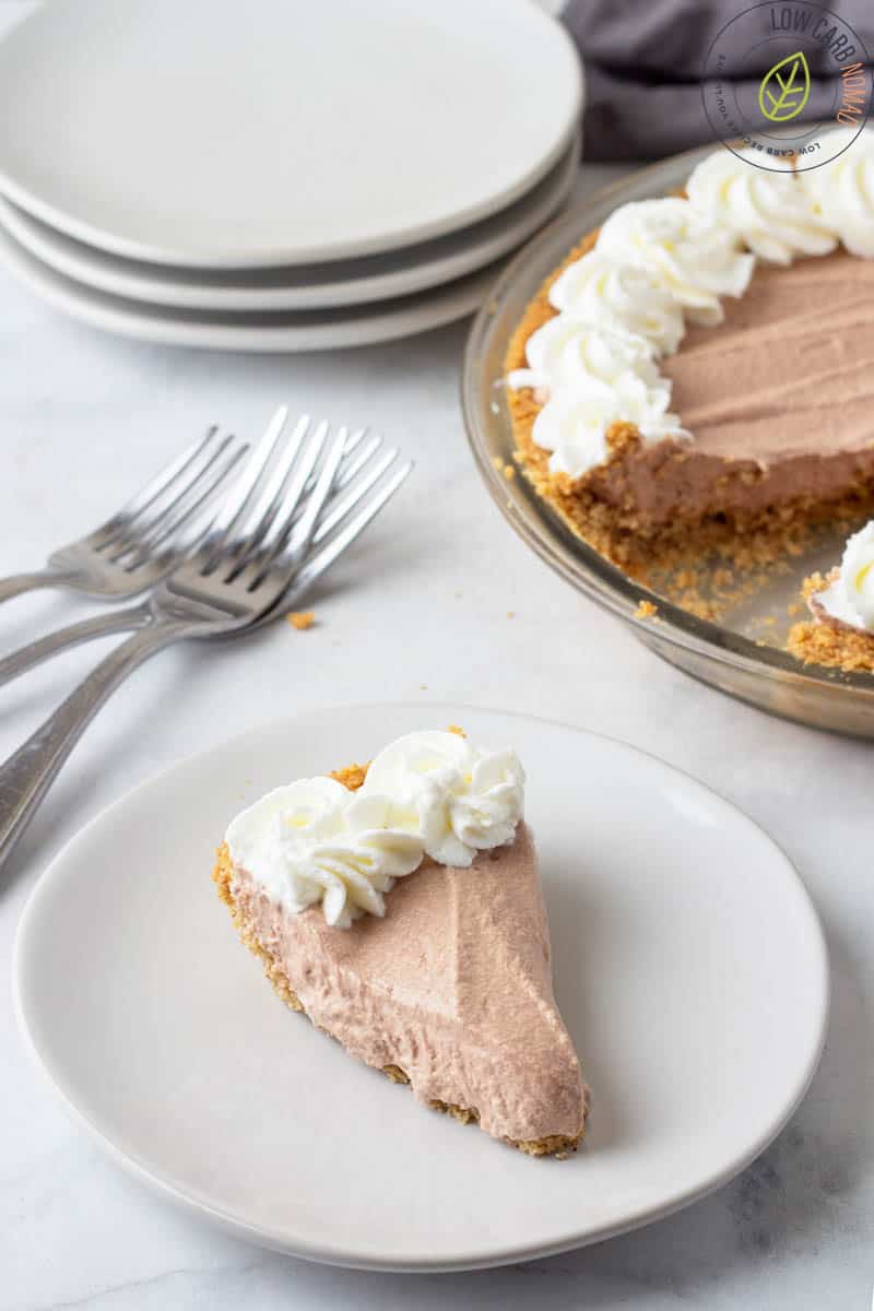 Chocolate Mousse Pie on a plate  with the pie in the background 