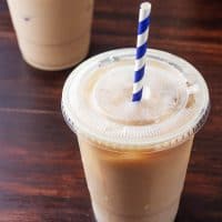 low carb iced coffee in a plastic cup with a straw