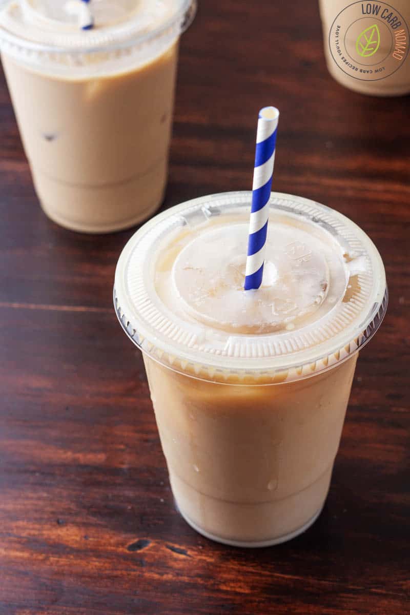 low carb iced coffee in a plastic cup with a straw