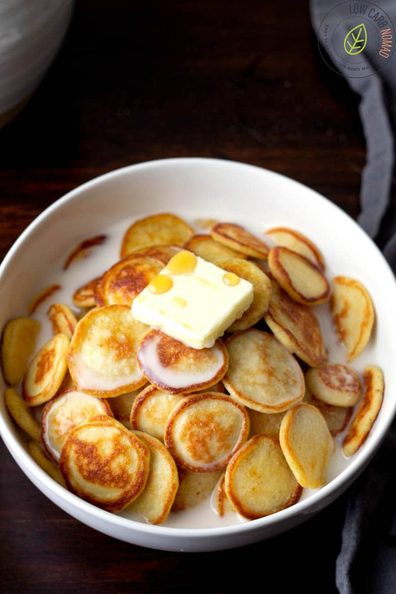 low carb pancakes in a bowl to make pancake cereal with milk, butter and sugar free maple syrup