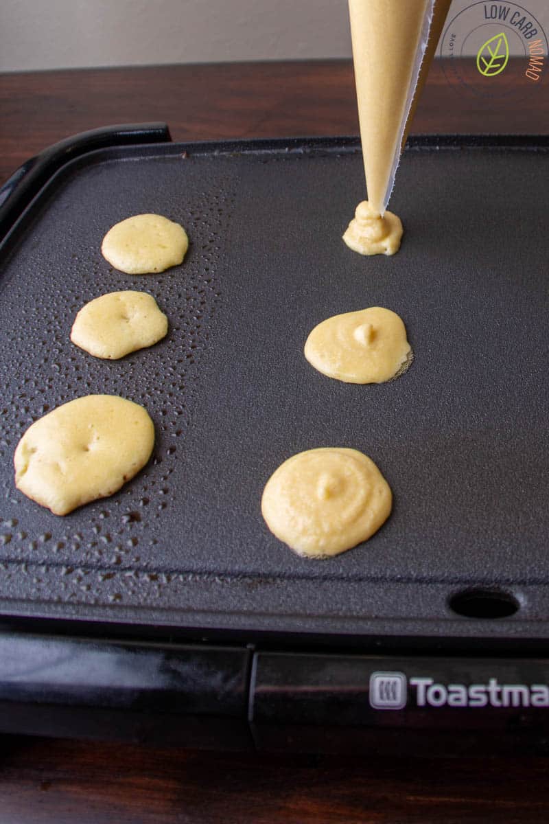 piping batter onto pan