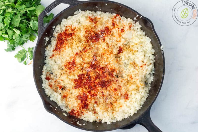 cauliflower and season cooking in skillet