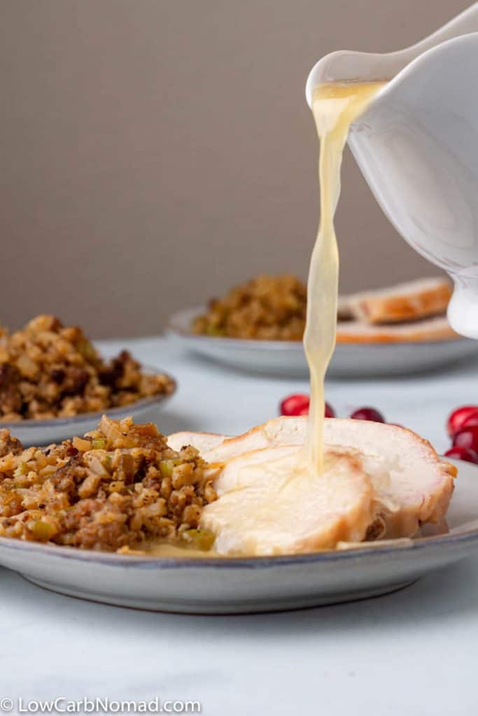 Keto Turkey Gravy being poured on turkey