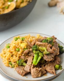 close up photo of low carb Keto Beef and Broccoli on a plate served with rice