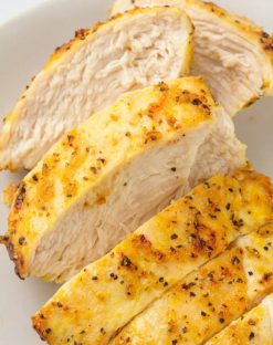 piece of lemon pepper chicken sliced on a plate