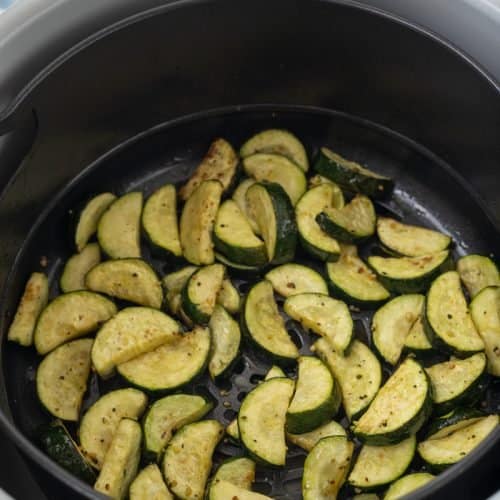 cooked zucchini in air fryer basket