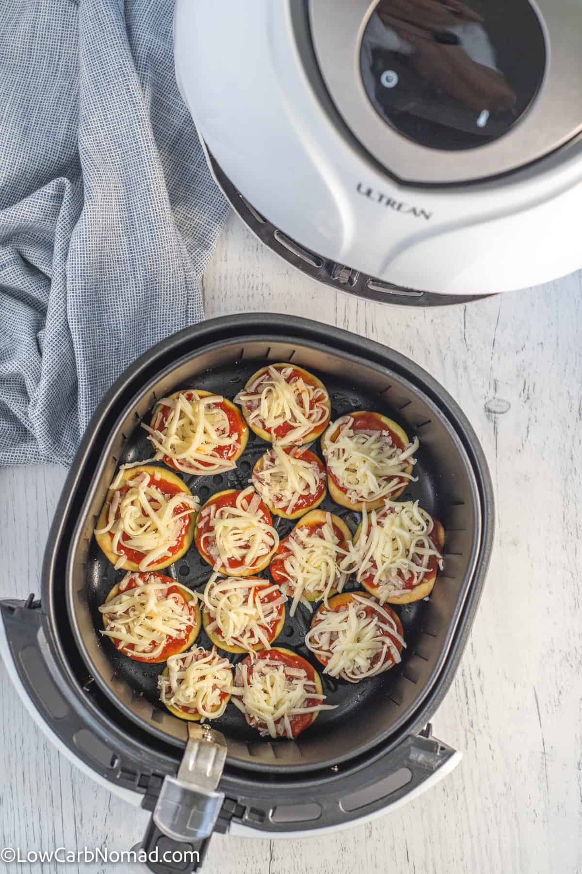 Keto low carb  uncooked eggplant pizza bites in the air fryer basket