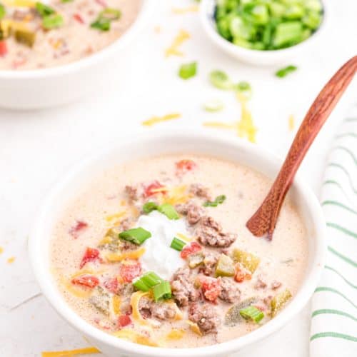 Keto Cheeseburger Soup in a white bowl with a spoon