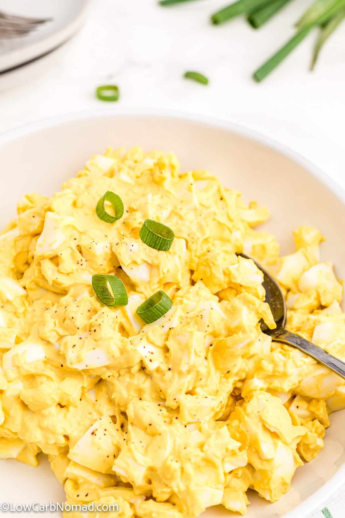 Keto Egg Salad in a bowl with a spoonful of egg salad