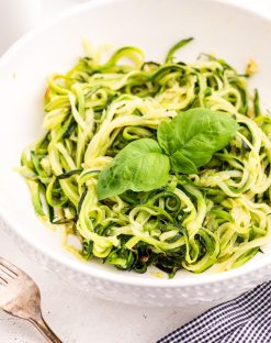 close up photo of a bowl of zucchini noodles
