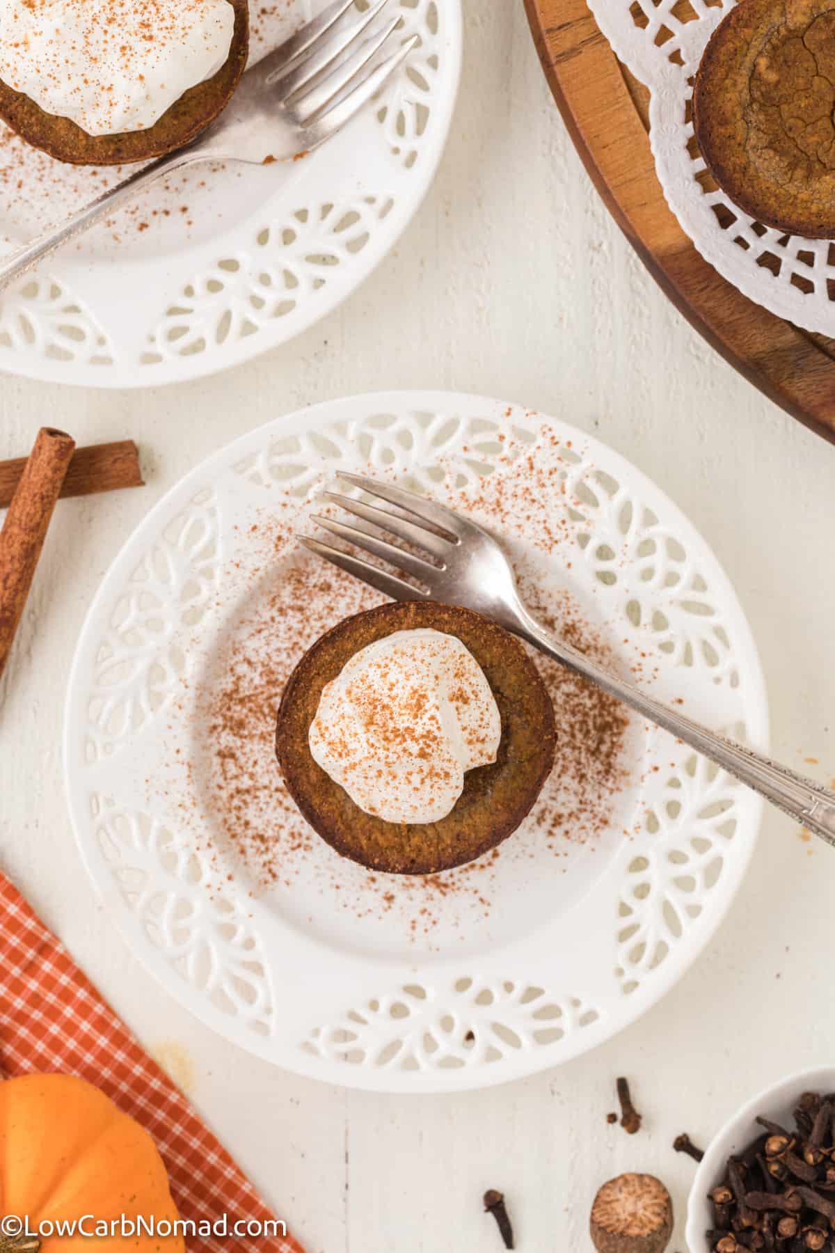 overhead photo of Mini Crustless Pumpkin Pie on a plate topped with whipped cream