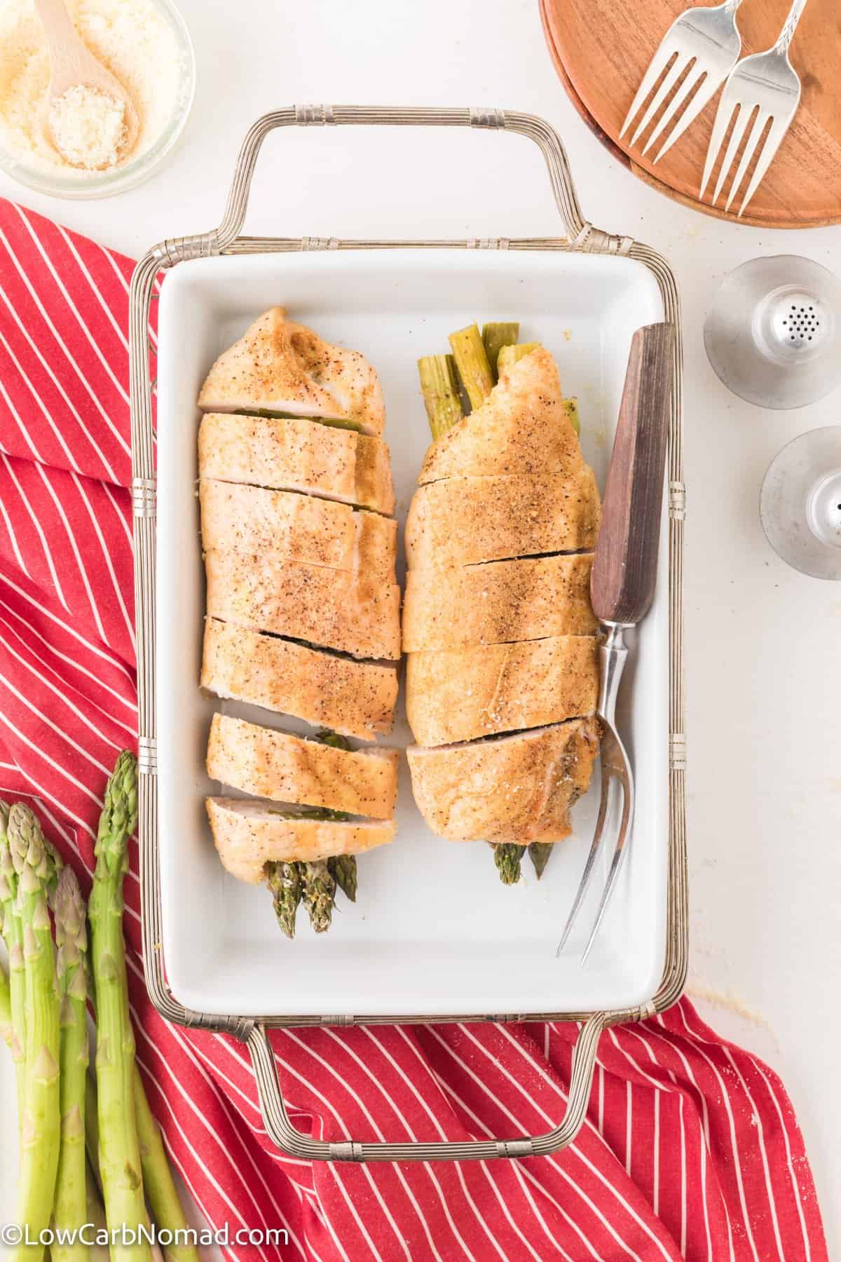 overhead photo of Keto asparagus stuffed chicken on a baking sheet