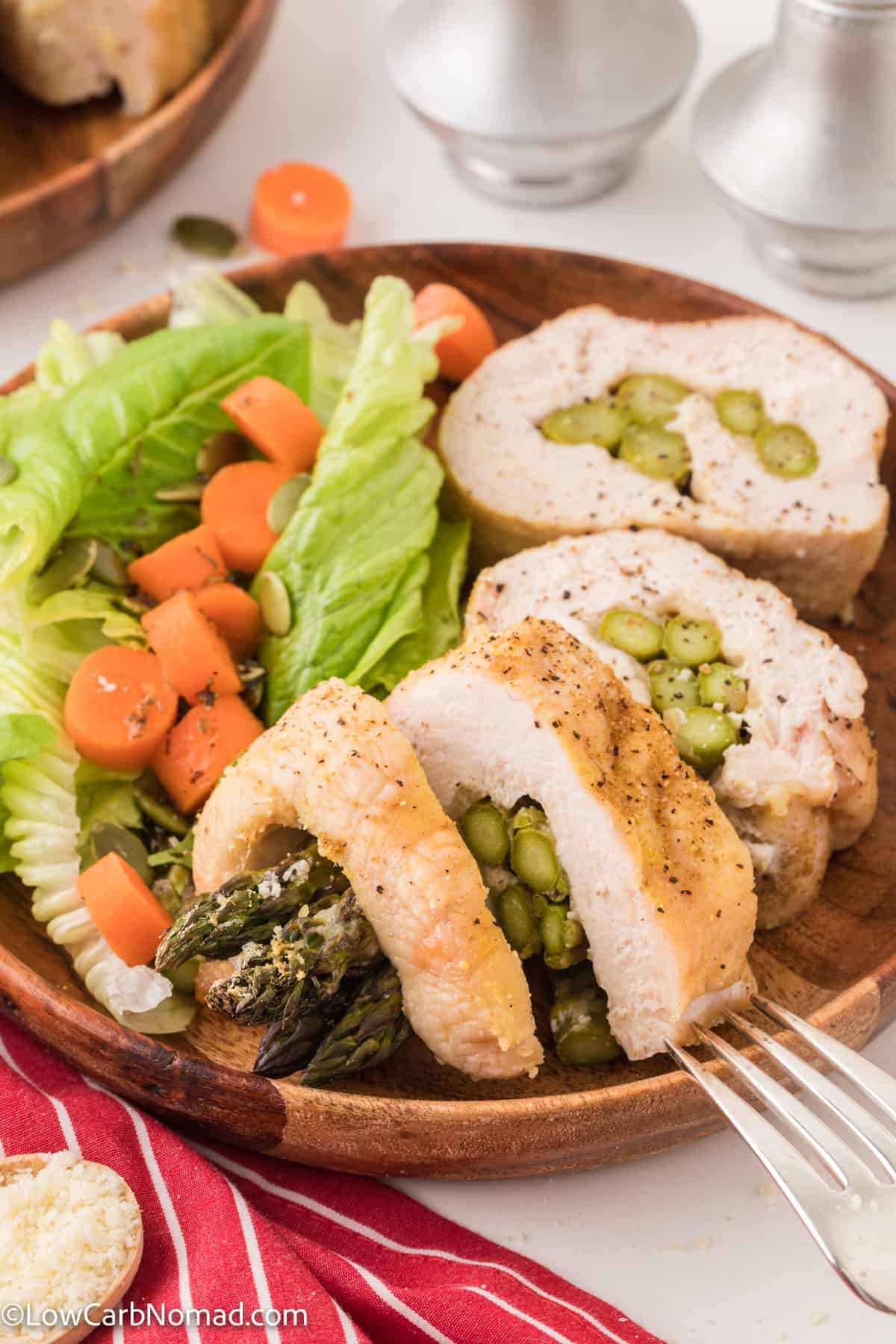 side view of Keto asparagus stuffed chicken on a plate
