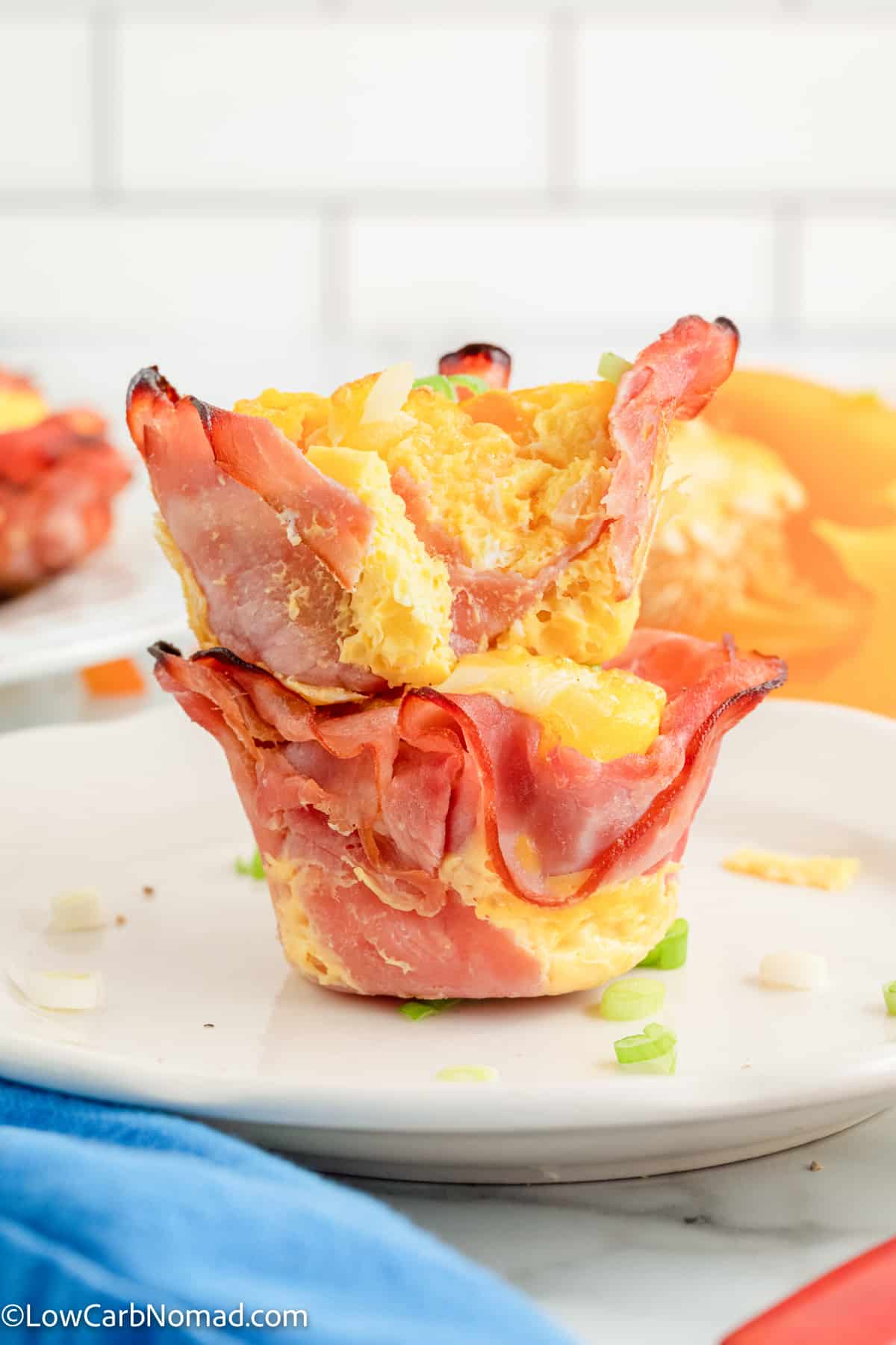 2 ham egg and cheese muffin cups stacked on top of each other