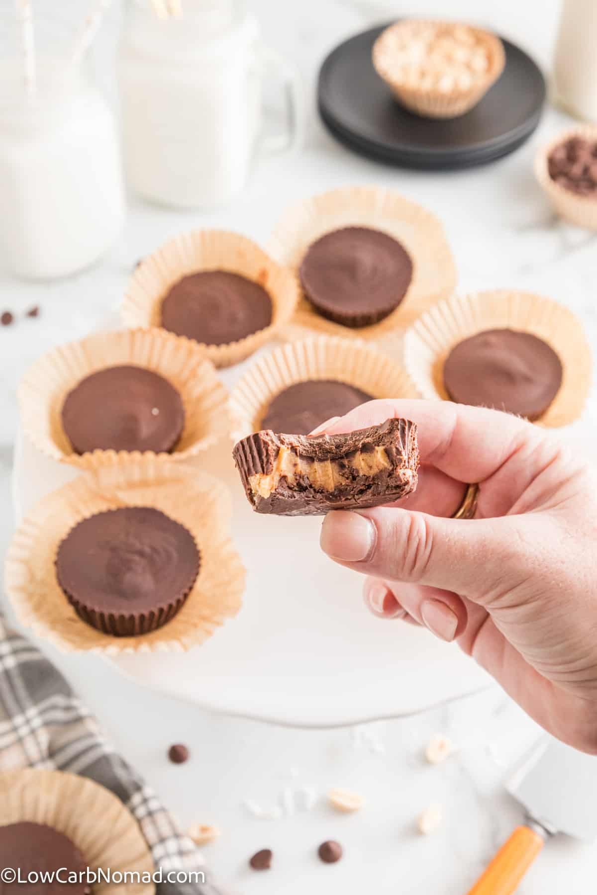 Keto Chocolate Peanut Butter Cups with a bite taken out of it