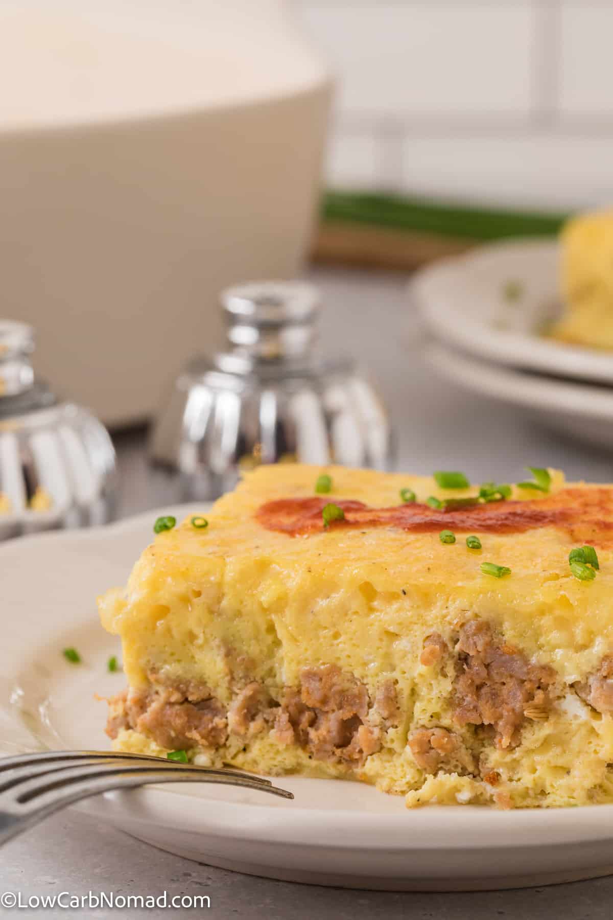 side view of Sausage Egg and Cheese Breakfast Casserole on a plate
